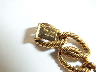 Lot 31 - An 18ct yellow gold rope twist curb link bracelet by Boucheron