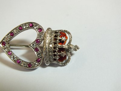Lot 88 - A 9ct white gold diamond, ruby and enamel heart and crown brooch