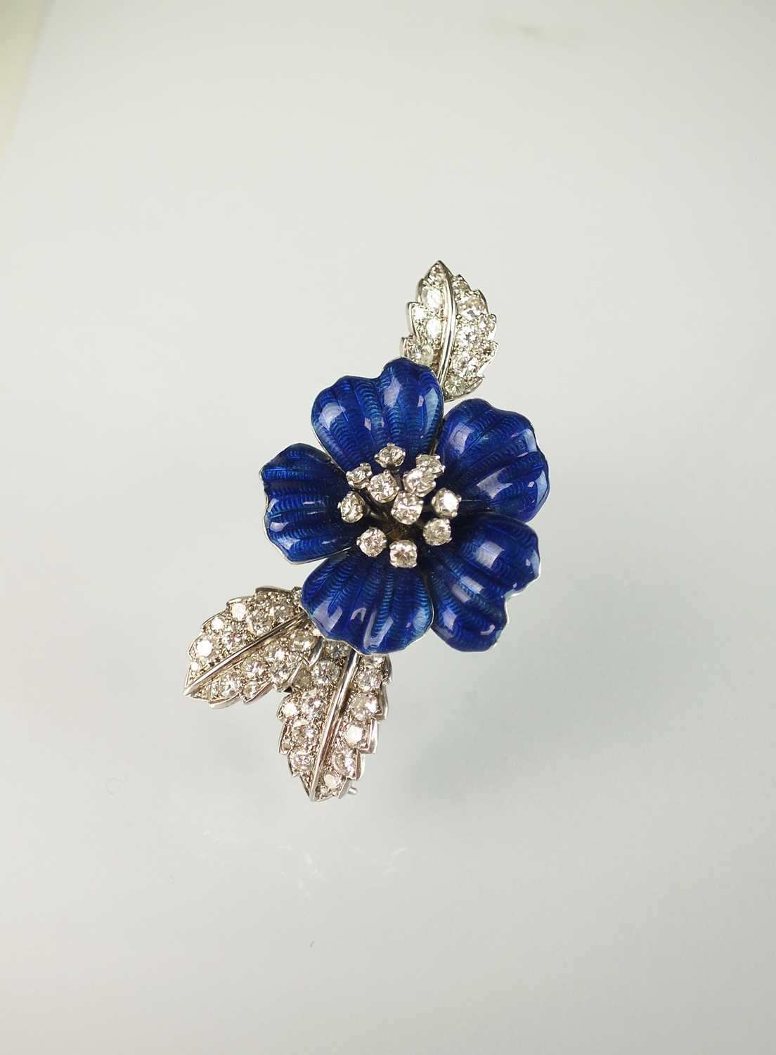 34 - A blue enamel and diamond flower brooch by Boucheron