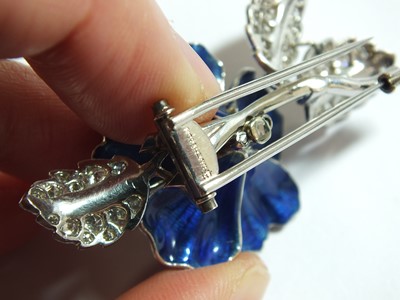 Lot 34 - A blue enamel and diamond flower brooch by Boucheron