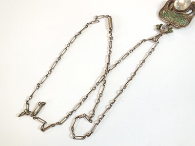 Lot 133 - An Arts and Crafts moonstone and enamel pendant in the style of Jessie M King