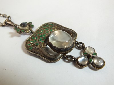 Lot 133 - An Arts and Crafts moonstone and enamel pendant in the style of Jessie M King