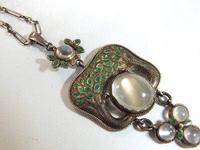 Lot 133 - An Arts and Crafts moonstone and enamel pendant in the style of Jessie M King