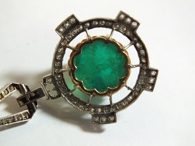 Lot 108 - An Art Deco emerald and diamond pendant on chain