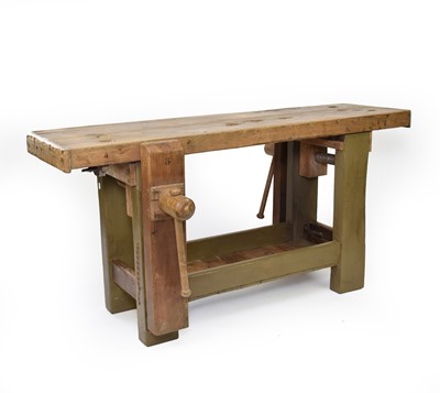 Lot 66 - An early 20th century beech workbench with integral vices