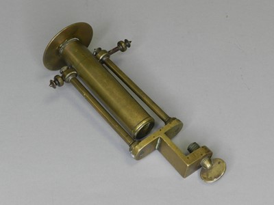 Lot 21 - A 19th century brass ship’s gimbal candle holder