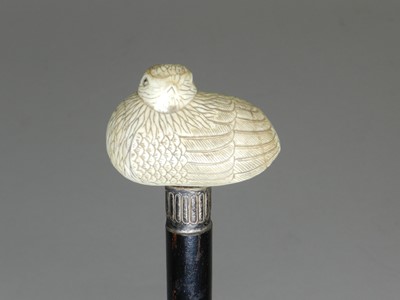 Lot 19 - A late Victorian ivory-topped and silver mounted ebonised cane