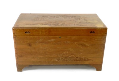 Lot 599 - A South East Asian carved camphor wood chest