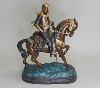 Lot 281 - A patinated and painted spelter equestrian...