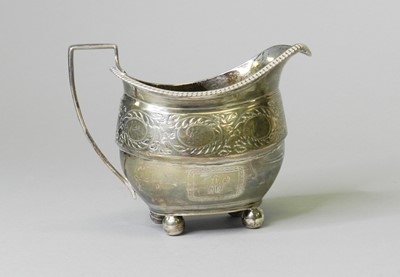 Lot 157 - A George III silver cream jug