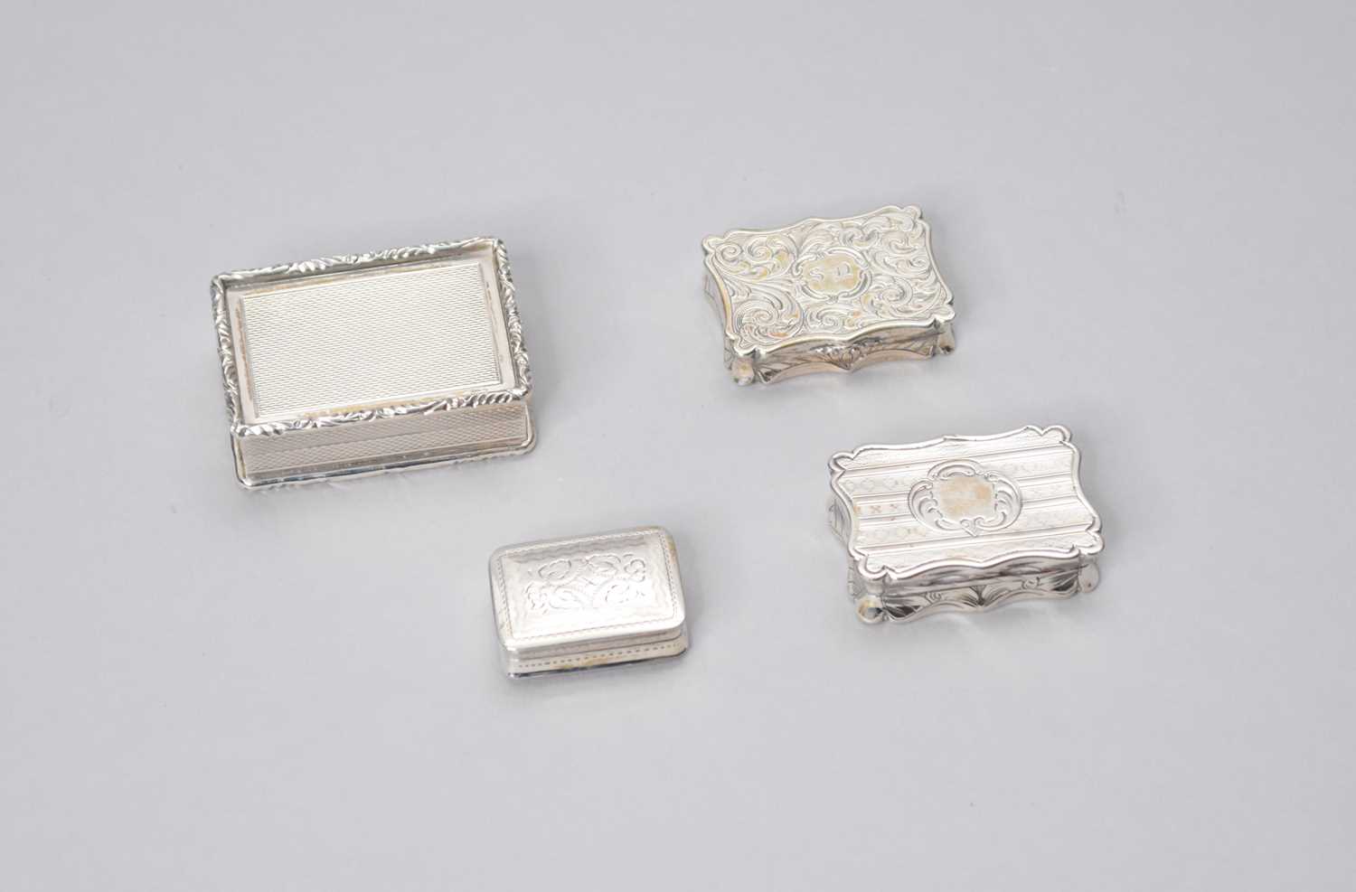Lot 10 - Three silver vinaigrettes and a silver pill box