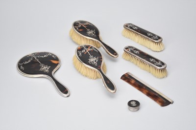Lot 343 - A silver and tortoiseshell mounted dressing table set