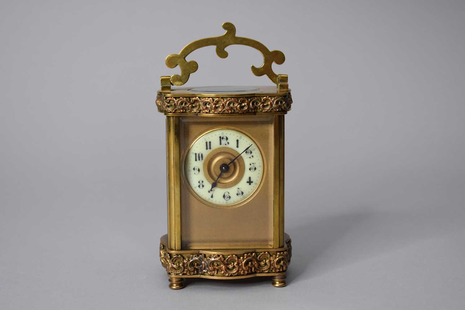 Lot 162 - An early 20th century French carriage timepiece, in a serpentine shaped case