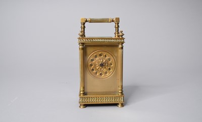 Lot 591 - An early 20th century French brass carriage timepiece, with fluted columns
