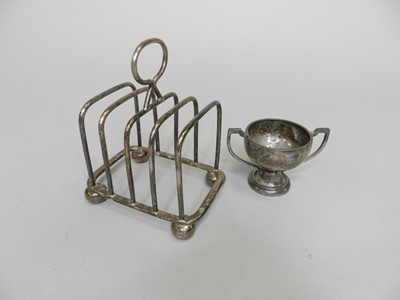 Lot 161 - A silver toast rack and trophy cup
