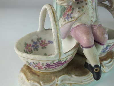 Lot 166 - A pair of German porcelain figural sweetmeat candelabra