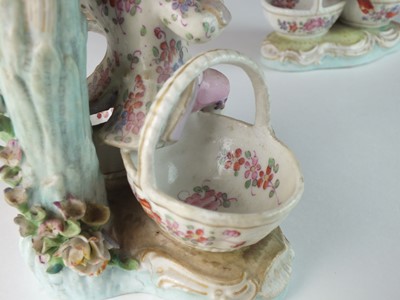 Lot 166 - A pair of German porcelain figural sweetmeat candelabra