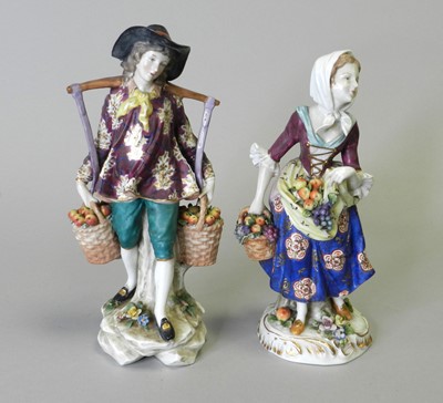 Lot 58 - A pair of Samson porcelain figures of male and female fruit vendors
