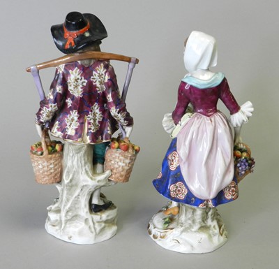 Lot 58 - A pair of Samson porcelain figures of male and female fruit vendors