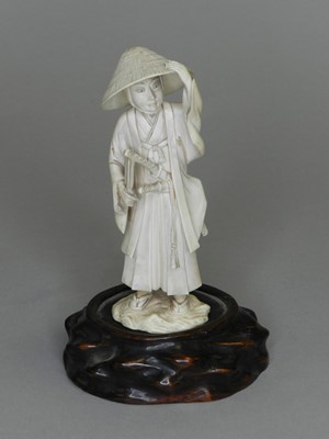Lot 240 - A Japanese ivory okimono of a gentleman