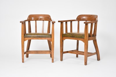 Lot 445 - A pair of Arts and Crafts style oak elbow chairs