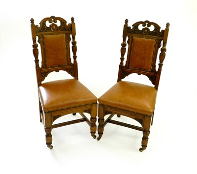 Lot 173 - A set of six late Victorian carved oak leather upholstered dining chairs