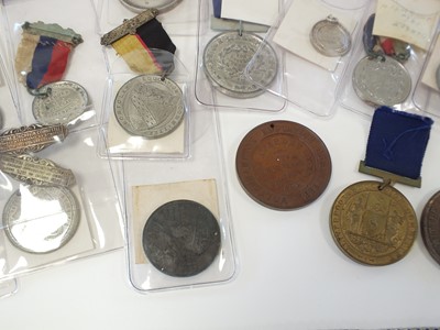 Lot 27 - Twenty-five silver, white metal and bronze school attendance medals
