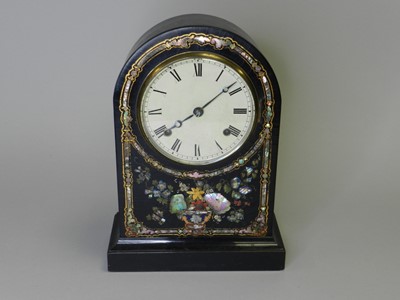 Lot 323 - A 19th century arched, ebonised, mantel clock, probably with an American,  8-day movement