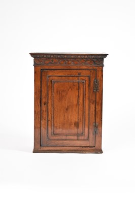 Lot 561 - An 18th century and later oak cupboard