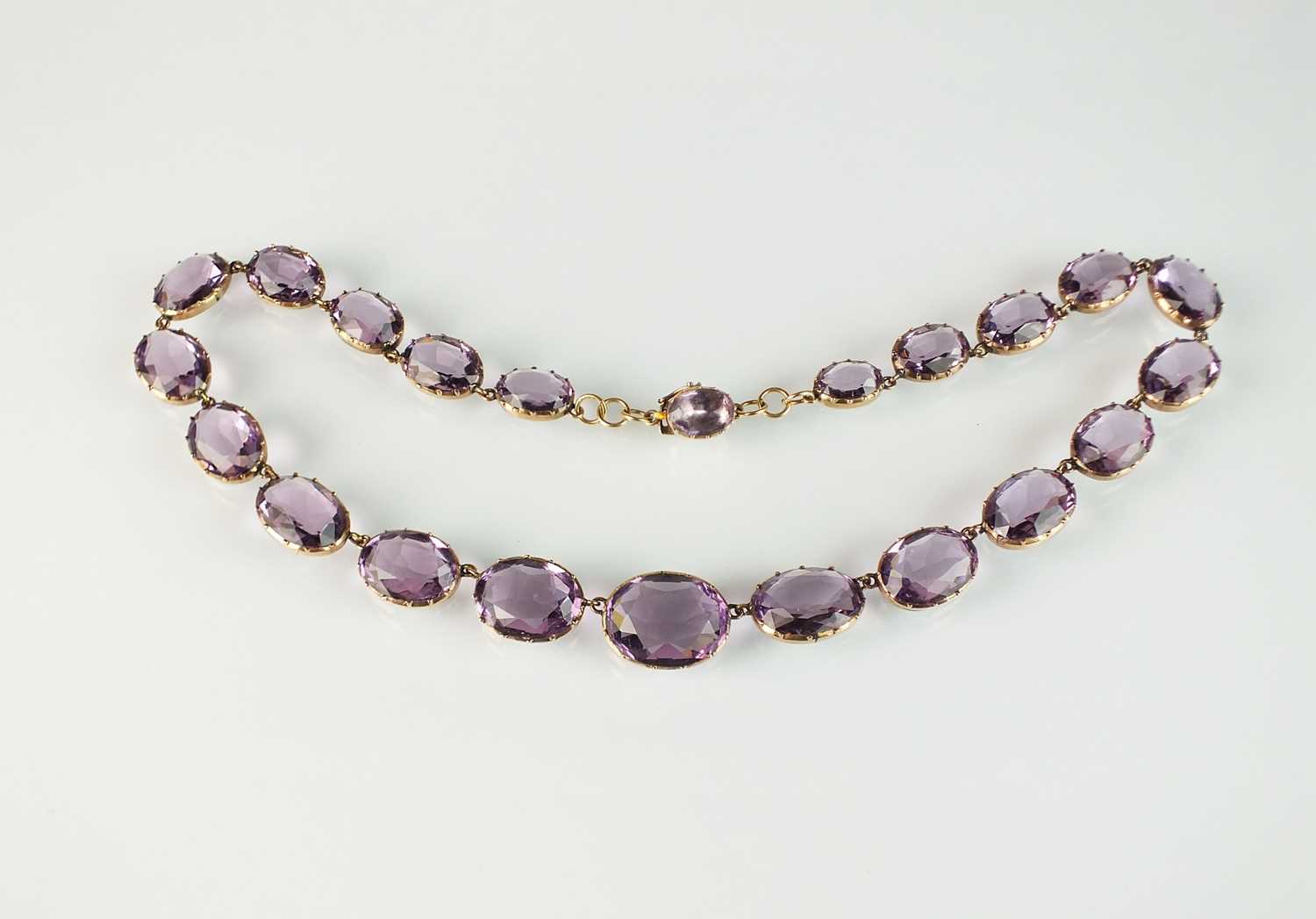 Lot 81 - A 19th century purple paste riviere necklace
