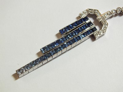 Lot 69 - An Art Deco style sapphire and diamond pendant