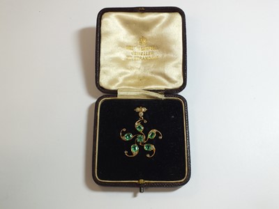 Lot 56 - An emerald and diamond stylised star pendant