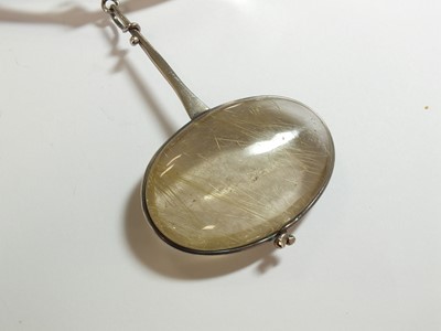 Lot 42 - A Georg Jensen silver neck ring and rutilated quartz pendant designed by Vivianna Torun Bulow-Hube