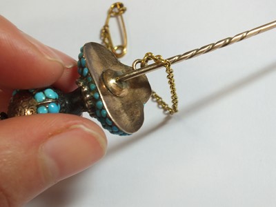 Lot 102 - An early Victorian turquoise, pearl, diamond and garnet Blackamoor pin