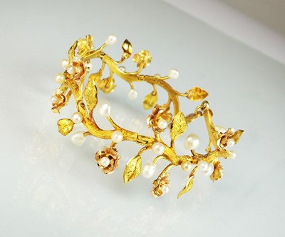 Lot 111 - A pearl set stylised flower bracelet