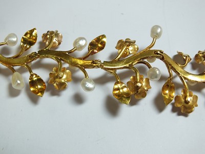 Lot 111 - A pearl set stylised flower bracelet