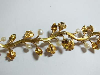 Lot 111 - A pearl set stylised flower bracelet