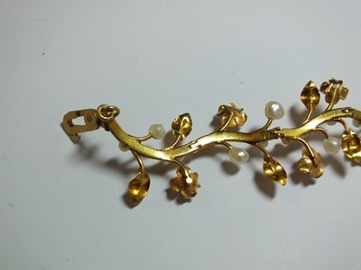 Lot 111 - A pearl set stylised flower bracelet