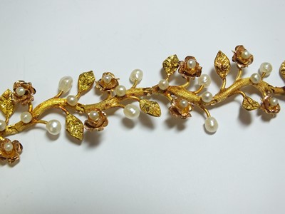 Lot 111 - A pearl set stylised flower bracelet