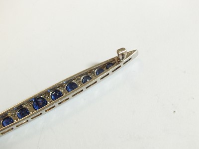 Lot 68 - A Victorian style graduated sapphire and diamond line brooch