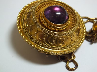 Lot 129 - A Victorian garnet set locket brooch, designed...