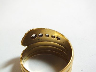 Lot 92 - An 18ct gold diamond set snake ring