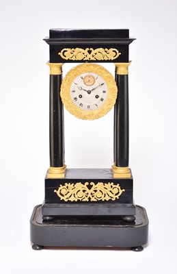 Lot 464 - A 19th century ebonised and gilt metal mounted portico clock