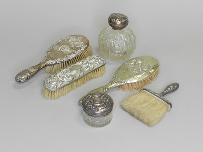 Lot 154 - A silver topped glass perfume bottle