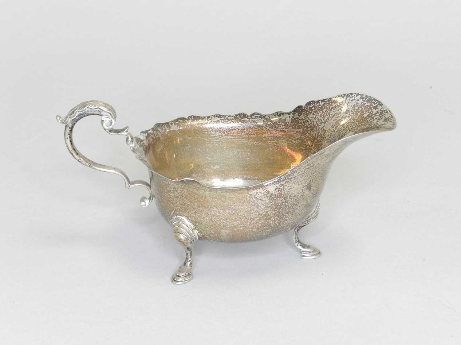 Lot 141 - A silver sauce boat