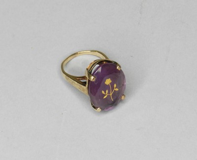 Lot 180 - A amethyst set dress ring