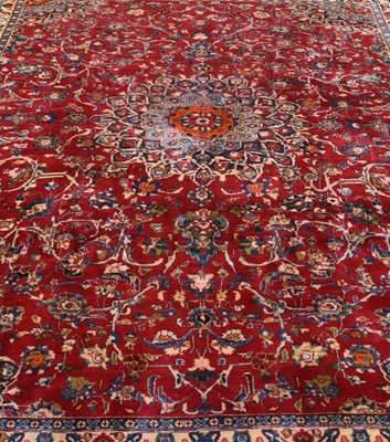 Lot 255 - A large Persian Mashad carpet