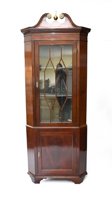 Lot 624 - A 19th century mahogany veneered floor standing corner cupboard