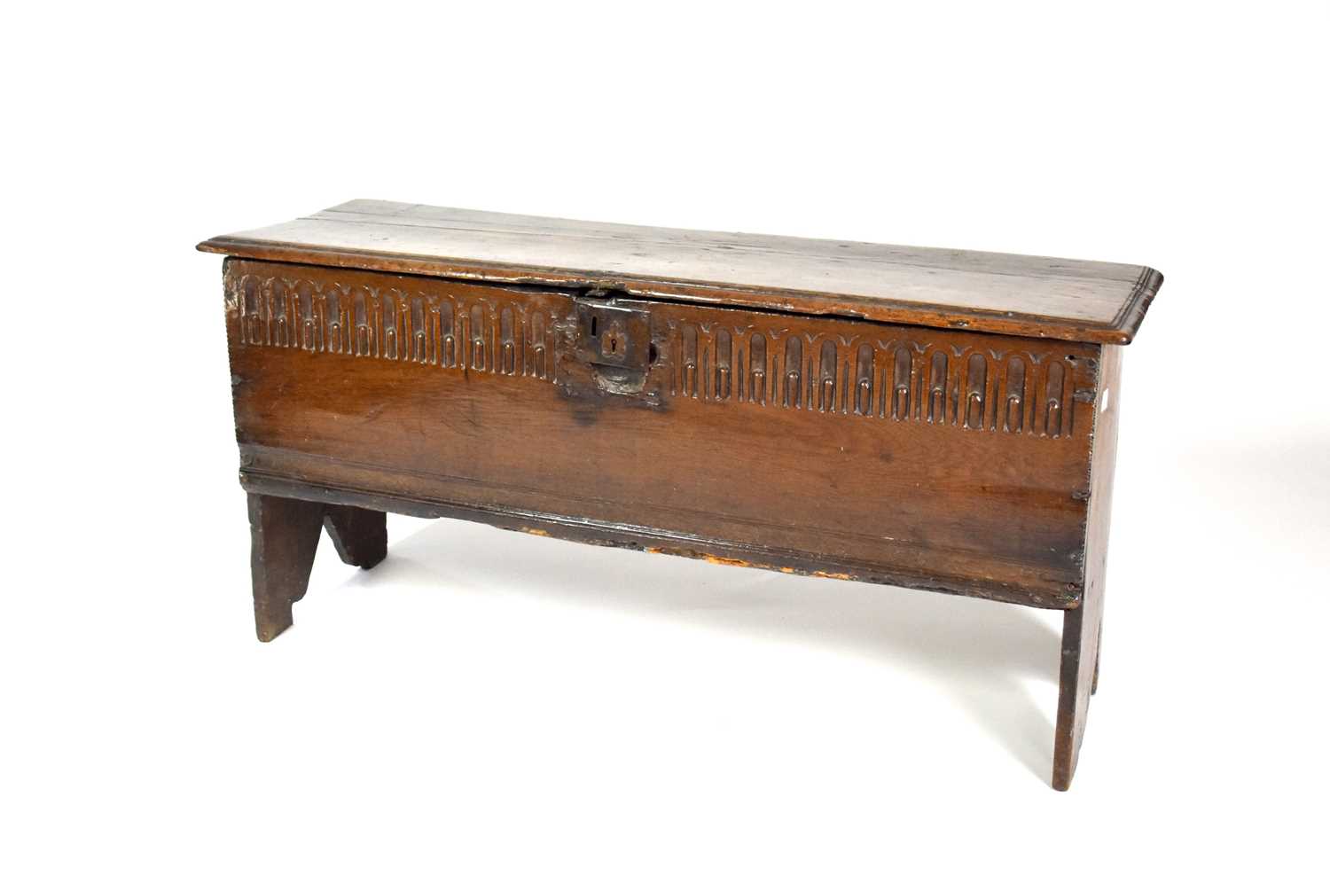 Lot 236 - A 17th century, oak, 6-plank coffer with a stopped null carved front