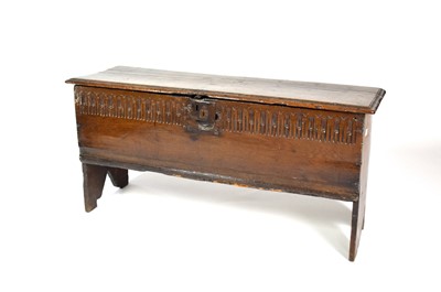 Lot 236 - A 17th century, oak, 6-plank coffer with a stopped null carved front